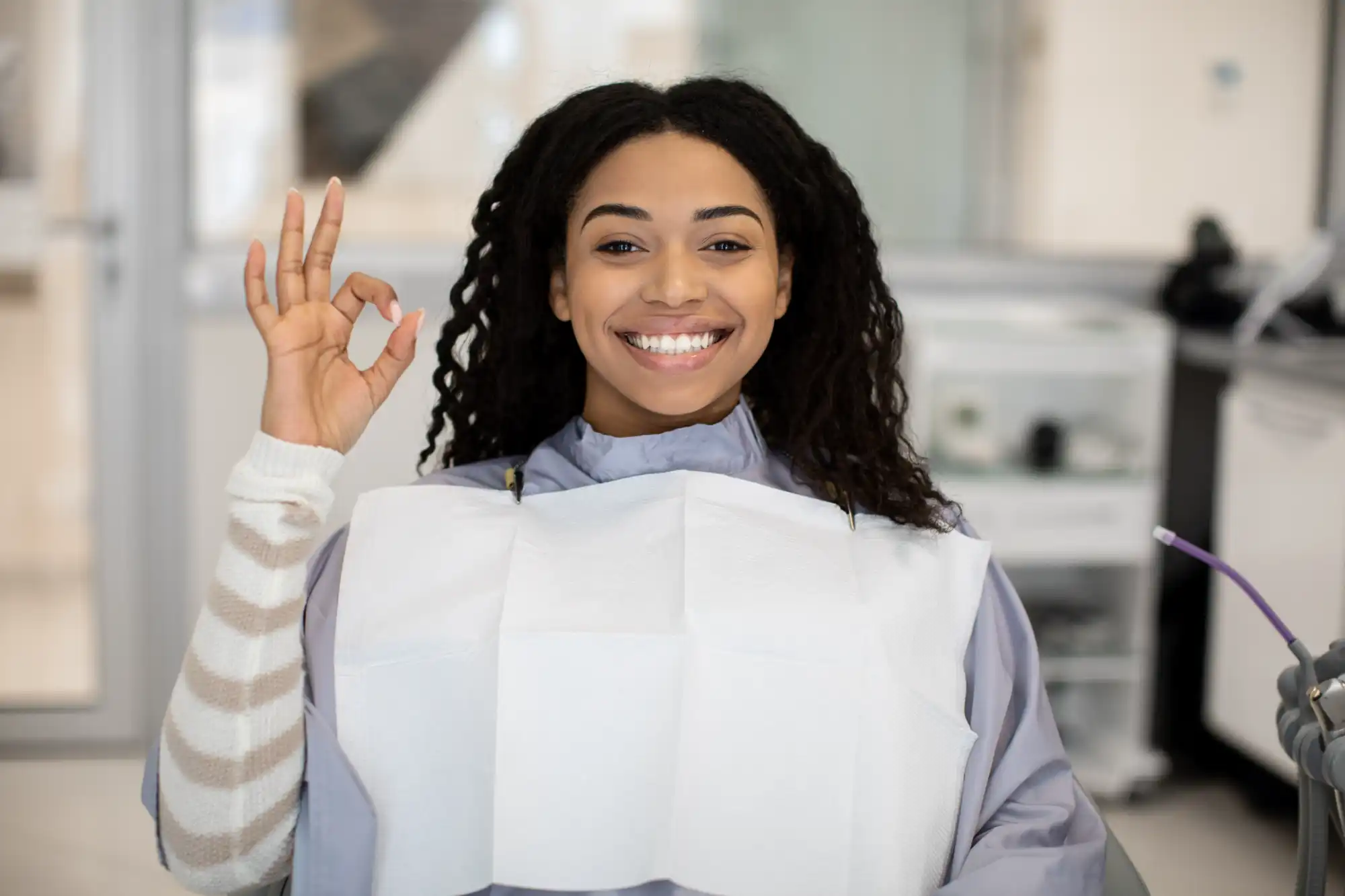 Happy Dental Patient Giving "OK" SIgn